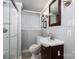 Bathroom with tiled shower, toilet, sink and a dark vanity with a mirror at 1501 Fern Forest Dr, Gastonia, NC 28054