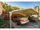 Spacious carport with a concrete slab fits two cars, offering protection from the elements and convenience at 1501 Fern Forest Dr, Gastonia, NC 28054