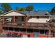 Large deck with a porch swing, offers an inviting space for outdoor relaxation and enjoying the surrounding views at 1501 Fern Forest Dr, Gastonia, NC 28054