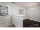 Dining room with hardwood floors, bright lighting, and neutral white colors at 1501 Fern Forest Dr, Gastonia, NC 28054