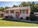 Charming two-story home with light yellow siding, red shutters, and a well-manicured lawn at 1501 Fern Forest Dr, Gastonia, NC 28054