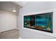 This room features a large built in aquarium, light grey walls, and wood look flooring at 1501 Fern Forest Dr, Gastonia, NC 28054