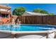 An inviting above-ground swimming pool with ladder access, surrounded by a wooden fence and cozy deck at 1501 Fern Forest Dr, Gastonia, NC 28054