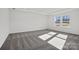 Spacious bedroom with plush gray carpet, neutral walls, and ample natural light from large windows at 15015 Meadows Hunt Ln # 164, Huntersville, NC 28078