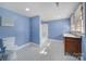 Bright bathroom features double sinks, tub-shower combo, and striking black and white tiled floor at 1612 Forum Ln, Iron Station, NC 28080