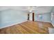 Spacious bedroom features hardwood flooring, an open doorway, and large windows at 1612 Forum Ln, Iron Station, NC 28080