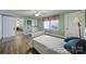 Inviting bedroom features hardwood floors, ceiling fan, and windows providing great natural light at 1612 Forum Ln, Iron Station, NC 28080