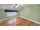 Bedroom features hardwood flooring, natural lighting, and neutral paint color at 1612 Forum Ln, Iron Station, NC 28080