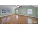 Bright bedroom showing hardwood floors, large windows, and neutral wall color at 1612 Forum Ln, Iron Station, NC 28080