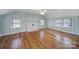 Spacious bedroom features hardwood flooring, plenty of natural light, and decorative fireplace at 1612 Forum Ln, Iron Station, NC 28080