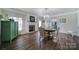 Elegant dining room with hardwood floors, fireplace, and a chandelier at 1612 Forum Ln, Iron Station, NC 28080