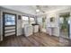 Functional laundry room with a washer, dryer, utility sink, tile flooring, and natural light at 1612 Forum Ln, Iron Station, NC 28080