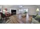 Bright living room with hardwood floors, fireplace, and large windows at 1612 Forum Ln, Iron Station, NC 28080