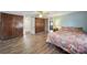 This large main bedroom features hardwood floors, a ceiling fan, and ample storage space at 1612 Forum Ln, Iron Station, NC 28080