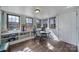 Cozy sun room with bright lighting, built-in shelves, and hardwood floors at 1612 Forum Ln, Iron Station, NC 28080