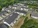 An aerial view of modern homes in a suburban community in a lush green environment at 212 Briana Marie Way, Indian Trail, NC 28079