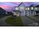 Charming two-story townhouse with attached garage and manicured lawn, perfect for modern living at 212 Briana Marie Way, Indian Trail, NC 28079