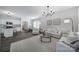 Spacious living area with an open layout, seamlessly connecting to the kitchen and dining space at 212 Briana Marie Way, Indian Trail, NC 28079