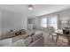 Bright and airy loft featuring a comfortable couch and workstation at 212 Briana Marie Way, Indian Trail, NC 28079