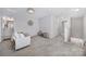 Spacious loft area with a comfortable seating area and lots of natural light at 212 Briana Marie Way, Indian Trail, NC 28079