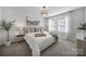 Comfortable main bedroom featuring a king bed, soft carpet, and abundant natural light at 212 Briana Marie Way, Indian Trail, NC 28079