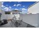 Outdoor patio featuring an umbrella table set and a white privacy fence at 212 Briana Marie Way, Indian Trail, NC 28079