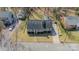 Aerial view of a quaint home featuring a neatly landscaped yard and tree-lined street at 285 Fryling Sw Ave, Concord, NC 28025