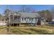View of the home's backyard, featuring a screened porch and ample outdoor space at 285 Fryling Sw Ave, Concord, NC 28025