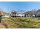 Charming home featuring a screened porch and a well-maintained backyard with seating at 285 Fryling Sw Ave, Concord, NC 28025