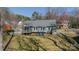 The backyard features a cozy screened porch and a patio with plenty of space to relax at 285 Fryling Sw Ave, Concord, NC 28025
