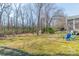 Lush backyard with scattered trees and seating area, perfect for outdoor relaxation at 285 Fryling Sw Ave, Concord, NC 28025