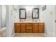 Bathroom featuring a double sink vanity and a shower at 285 Fryling Sw Ave, Concord, NC 28025