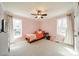 Bright bedroom with pink walls, two windows, and a ceiling fan, creating a cozy atmosphere at 285 Fryling Sw Ave, Concord, NC 28025