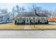 Charming single-story home with a brick walkway, manicured landscaping, and a welcoming entrance at 285 Fryling Sw Ave, Concord, NC 28025