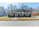 Charming single-story home with gray siding, mature trees, and inviting front porch at 285 Fryling Sw Ave, Concord, NC 28025