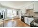 Bright kitchen with stainless steel appliances, hardwood floor, and natural light at 285 Fryling Sw Ave, Concord, NC 28025