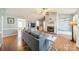 Cozy living room featuring a fireplace, ceiling fan, and hardwood floors at 285 Fryling Sw Ave, Concord, NC 28025