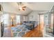 Open living room featuring vaulted ceiling, wood floors, and natural light at 285 Fryling Sw Ave, Concord, NC 28025