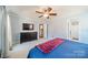 Comfortable main bedroom with ceiling fan, and ensuite bathroom at 285 Fryling Sw Ave, Concord, NC 28025