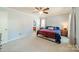 Spacious bedroom with neutral carpet, ceiling fan, and en-suite bathroom at 285 Fryling Sw Ave, Concord, NC 28025