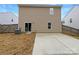 Backyard with concrete patio and sliding glass door leading into home at 3113 Ellingford Rd, Charlotte, NC 28214