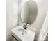 Bathroom with white vanity, oval mirror and matte black faucet at 3113 Ellingford Rd, Charlotte, NC 28214