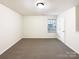 A carpeted bedroom offering natural light through a window at 3113 Ellingford Rd, Charlotte, NC 28214