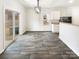 Dining area with luxury vinyl plank flooring and sliding glass doors to the patio at 3113 Ellingford Rd, Charlotte, NC 28214
