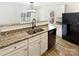Beautiful kitchen showcasing granite countertops, stainless steel sink, and modern lighting fixture at 3113 Ellingford Rd, Charlotte, NC 28214