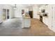 Open kitchen featuring white cabinets, granite countertops, black appliances and eat-in area at 3113 Ellingford Rd, Charlotte, NC 28214