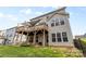 Exterior of home featuring a two-story deck, fenced yard, and well-manicured lawn at 3114 Woodlands Creek Dr, Monroe, NC 28110