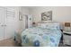A cozy bedroom featuring carpet, queen bed with light blue covers, and adjacent bathroom at 3114 Woodlands Creek Dr, Monroe, NC 28110