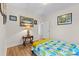 A cozy bedroom featuring decor and furnishings with hardwood floors, a small table and unique lighting at 3114 Woodlands Creek Dr, Monroe, NC 28110