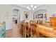 Formal dining room features a large wooden table and elegant chandelier at 3114 Woodlands Creek Dr, Monroe, NC 28110